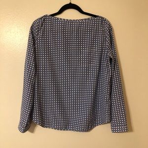 Boat neckline satin blouse.